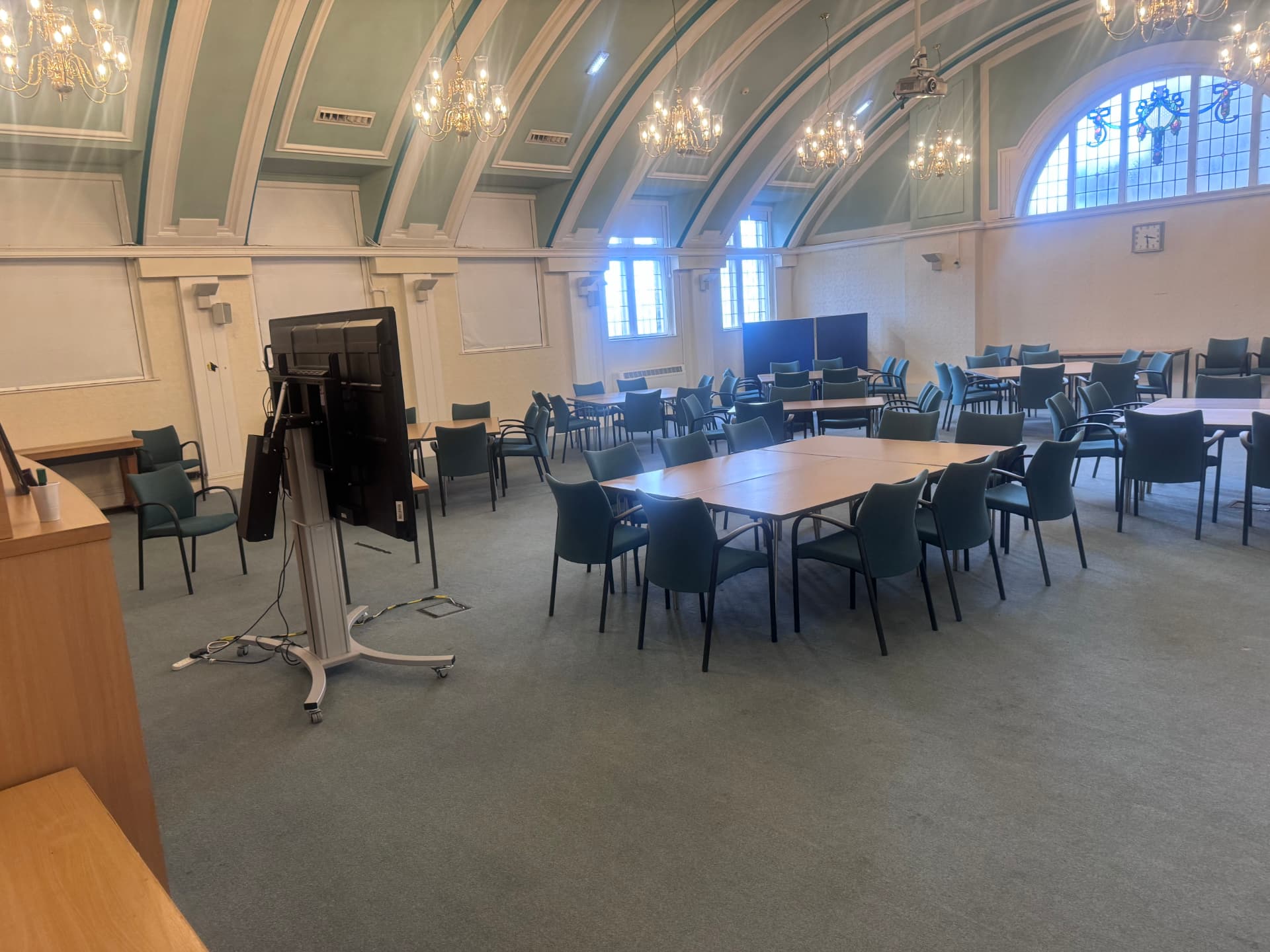 Inside Hyde Town Hall — the bright, chandelier-lit community hall where GalaActiveUk meets, set out with tables and chairs